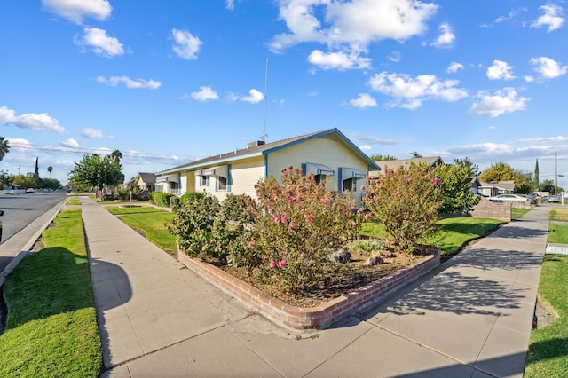 view of property exterior featuring a yard