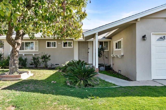 exterior space with a garage and a front yard