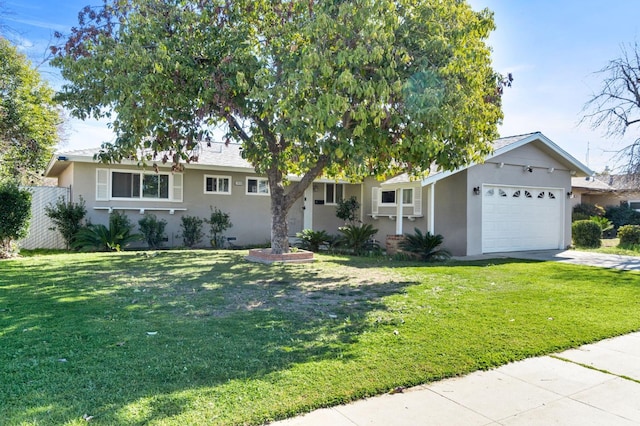 single story home featuring a garage and a front yard