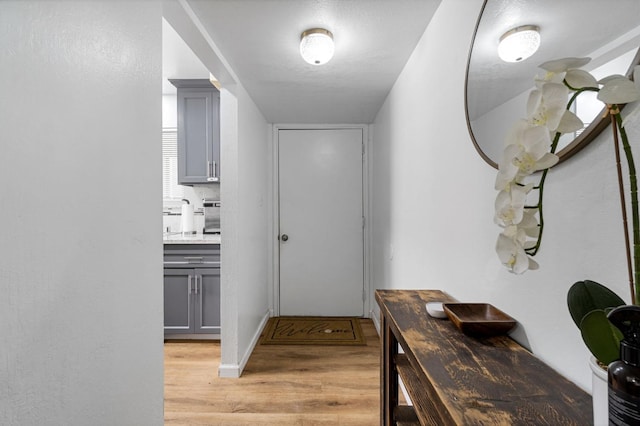 corridor featuring light hardwood / wood-style flooring