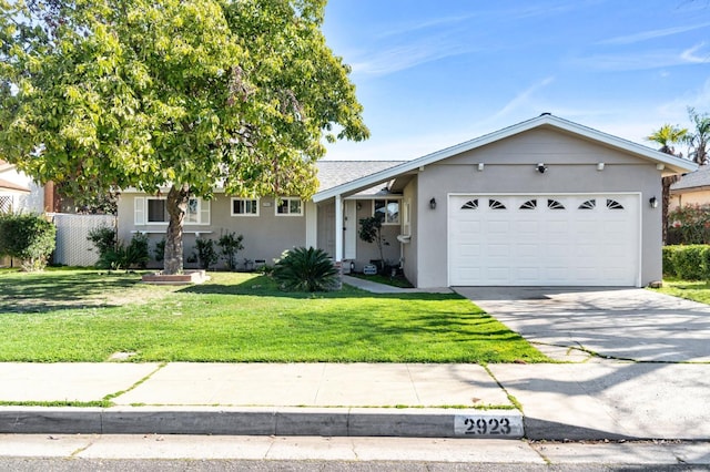 view of front of house with a garage and a front yard