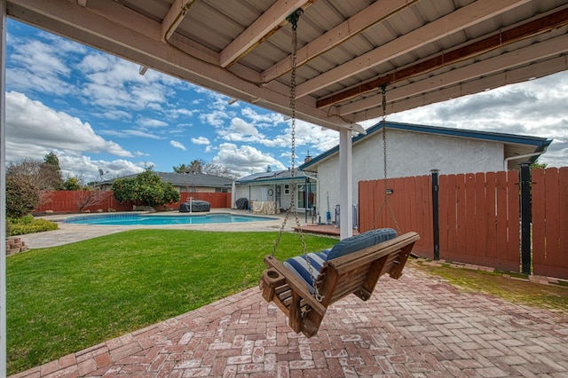 view of yard with a fenced in pool and a patio