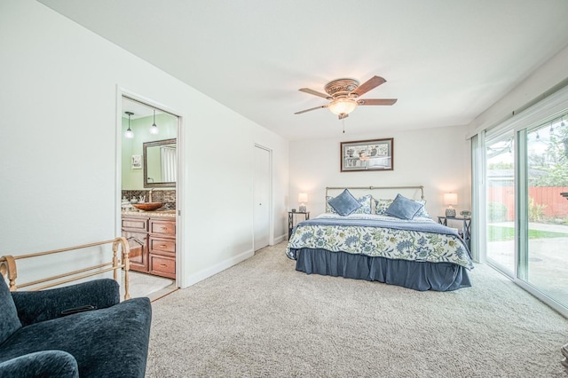 carpeted bedroom with connected bathroom, access to outside, and ceiling fan