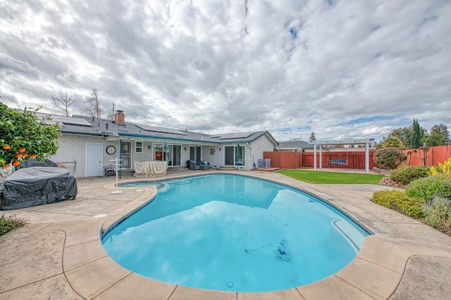 view of swimming pool featuring a patio area