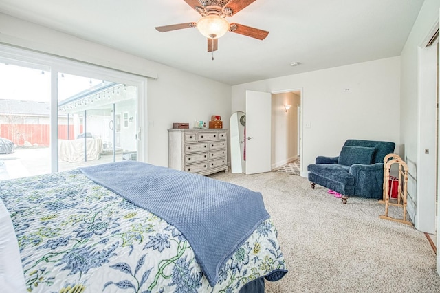 bedroom featuring access to outside, light colored carpet, and ceiling fan