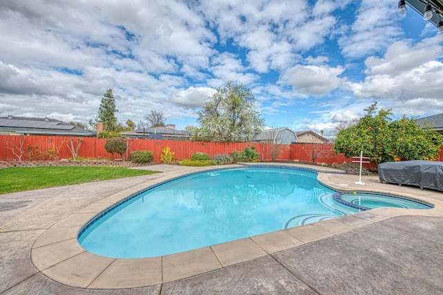 view of swimming pool with a patio