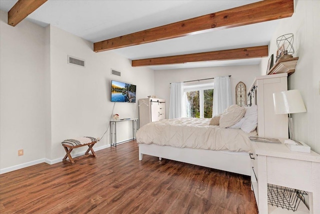 bedroom featuring beamed ceiling and dark wood-type flooring