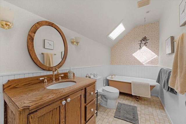 bathroom featuring a bathtub, vanity, breakfast area, vaulted ceiling, and toilet