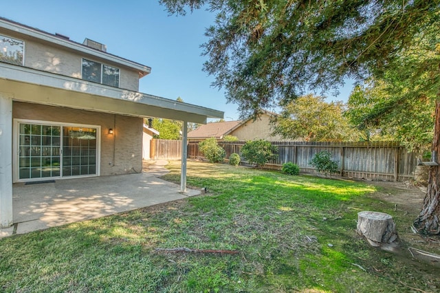 view of yard featuring a fenced backyard and a patio