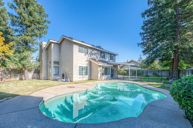 view of pool featuring a fenced backyard, a patio area, a fenced in pool, and a yard