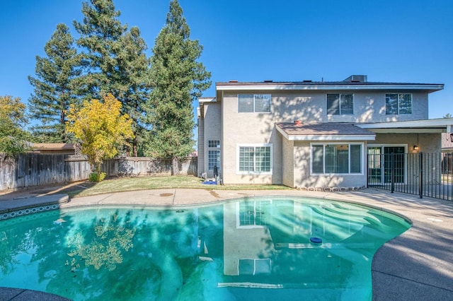 view of pool featuring a patio area, a fenced in pool, and a fenced backyard