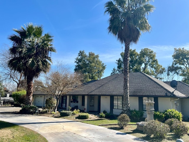 single story home featuring a garage