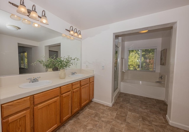 bathroom with independent shower and bath and vanity