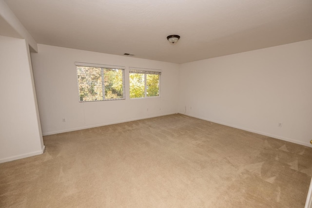 empty room with light colored carpet