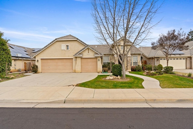 view of front of home with a garage and a front lawn