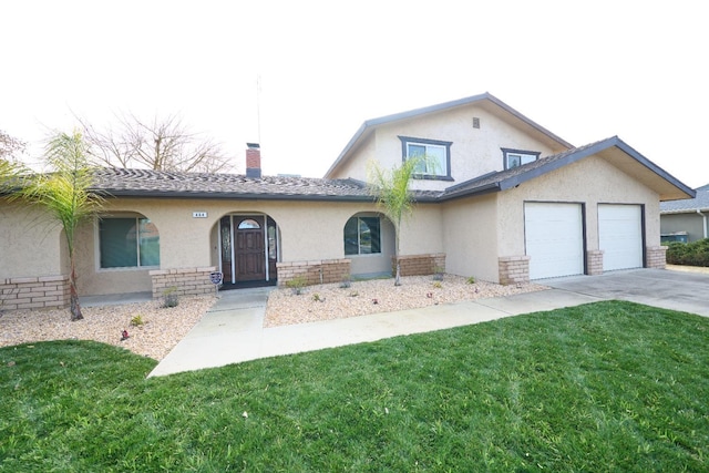 view of front facade featuring a garage and a front yard