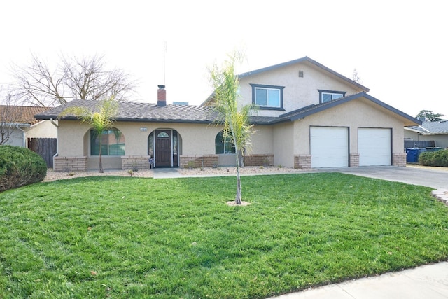 view of front of house with a garage and a front yard