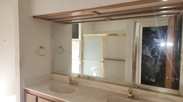 bathroom featuring vanity and walk in shower