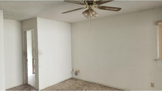 spare room featuring ceiling fan and a textured ceiling