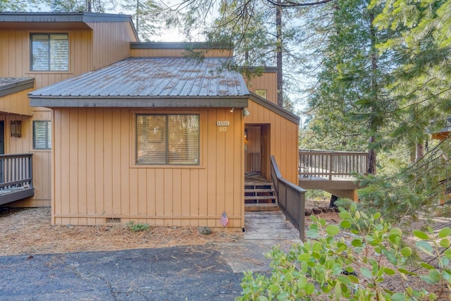 view of side of property with a wooden deck