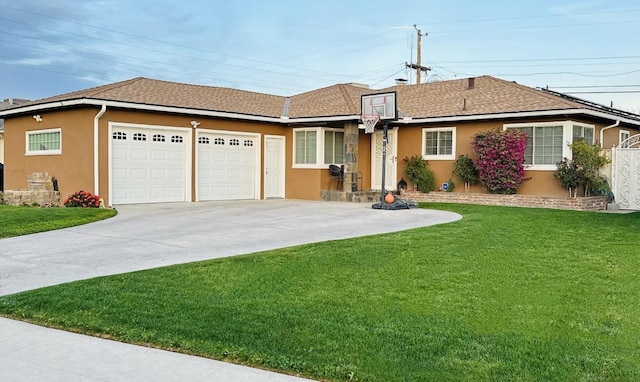 single story home featuring a front lawn and a garage