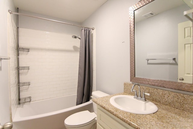 bathroom with toilet, vanity, visible vents, and shower / tub combo with curtain
