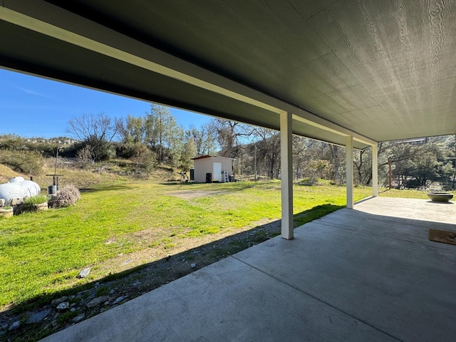 view of patio / terrace featuring an outbuilding