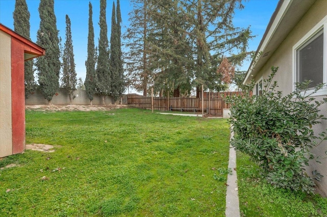 view of yard with a fenced backyard