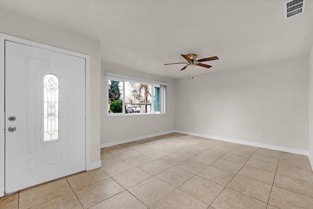 entrance foyer with baseboards, visible vents, ceiling fan, and light tile patterned flooring