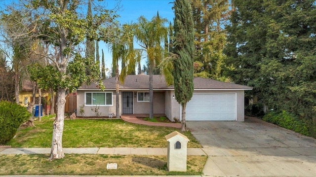 ranch-style house with a garage, stucco siding, concrete driveway, and a front yard