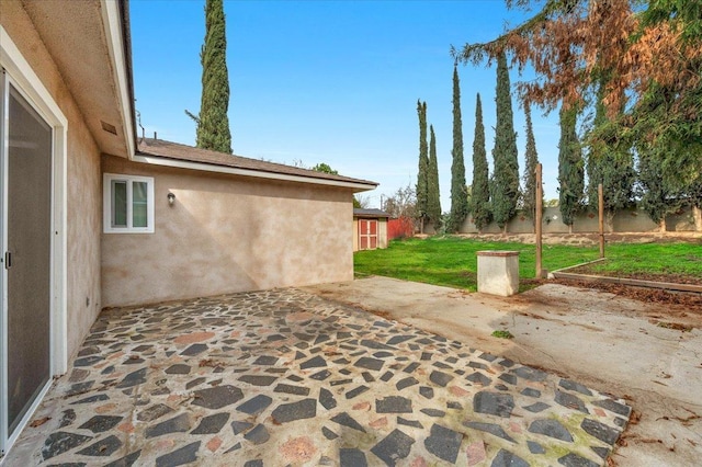 view of patio featuring fence