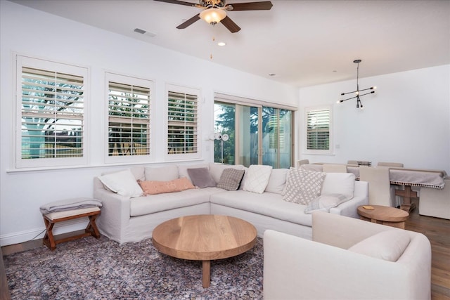 living room featuring hardwood / wood-style flooring and ceiling fan