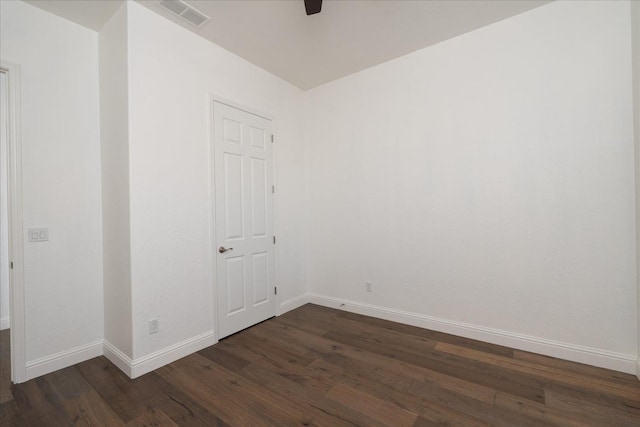 unfurnished room featuring dark hardwood / wood-style floors and ceiling fan