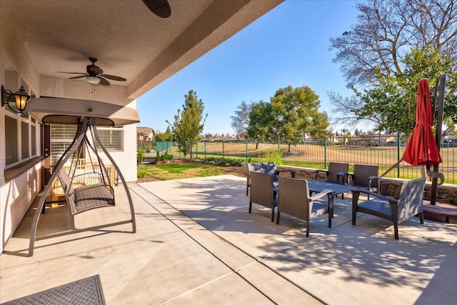 view of patio featuring ceiling fan