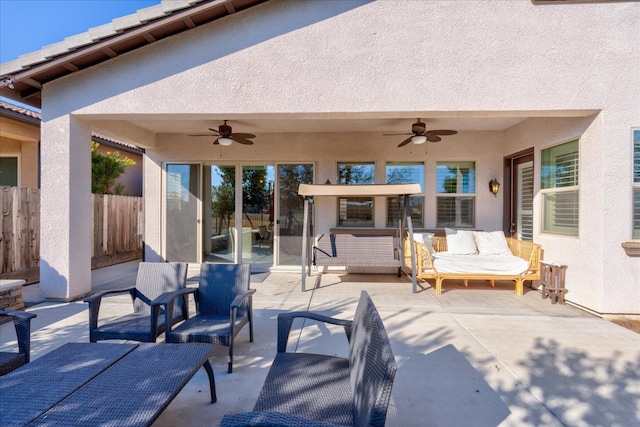 view of patio / terrace with ceiling fan and outdoor lounge area