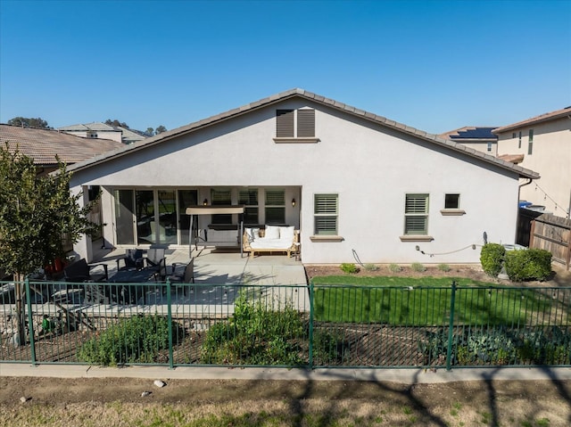 back of house featuring a patio