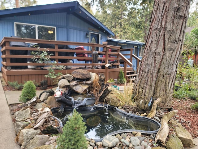 view of property exterior featuring a wooden deck