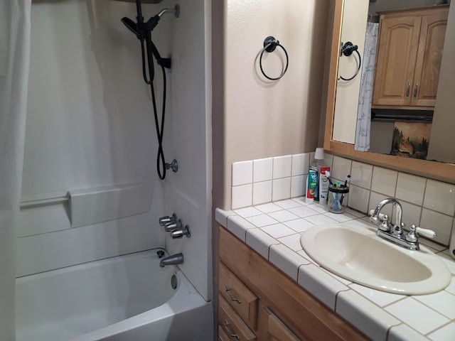 bathroom featuring vanity, backsplash, and shower / bath combination