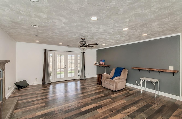 unfurnished room featuring french doors, dark hardwood / wood-style floors, and a textured ceiling