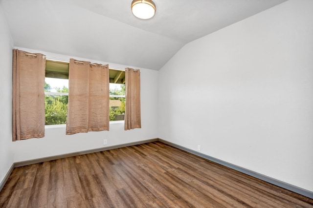 2567 S Rowell Ave, Fresno, CA 93725 - spare room with lofted ceiling and hardwood / wood-style flooring