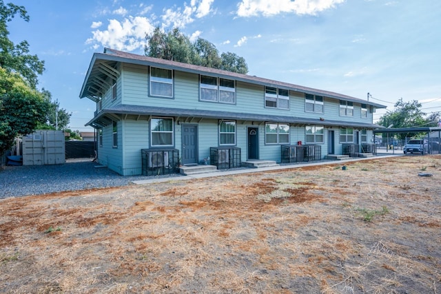 view of front of property with a carport