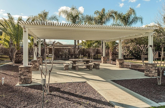 view of property's community featuring a patio and a pergola