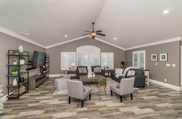 living room featuring lofted ceiling, crown molding, light hardwood / wood-style floors, and ceiling fan