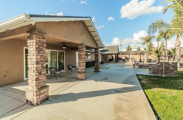 view of patio featuring ceiling fan