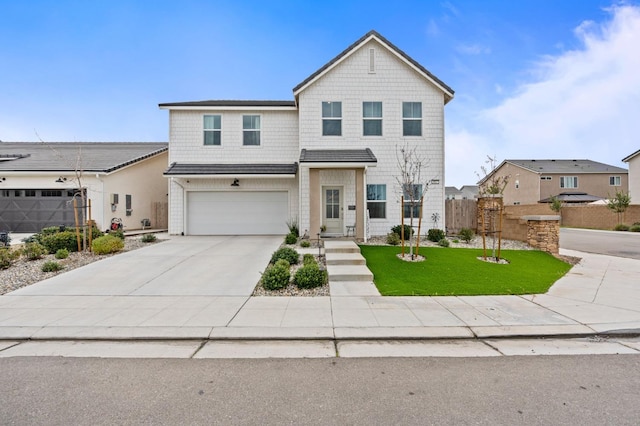 front of property featuring a garage and a front yard