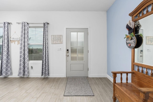 entryway with light hardwood / wood-style floors