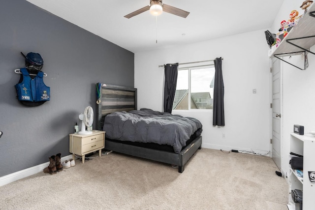 bedroom with ceiling fan and light carpet