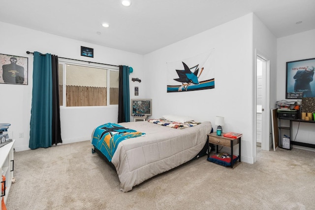 bedroom with light colored carpet