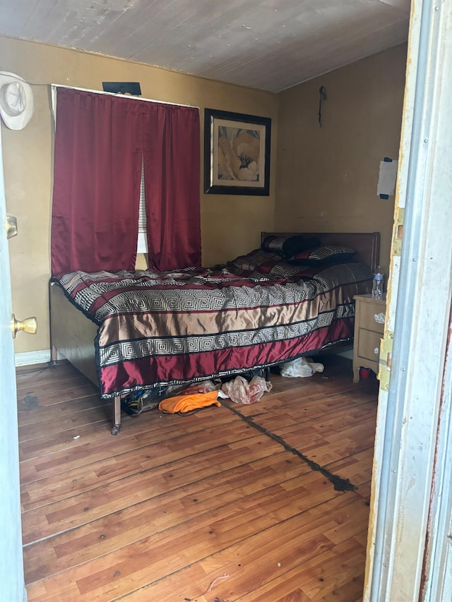 bedroom with hardwood / wood-style flooring