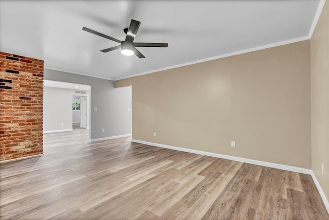 empty room with ceiling fan, ornamental molding, and light hardwood / wood-style floors